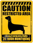 Add a touch of retro charm to your space with our Vintage Dachshund Tin Sign. This eye-catching decorative metal plate is not just a piece of art; it's also a playful warning sign that reads, "Caution Restricted Area - 24 Hour Monitoring." Crafted with meticulous attention to detail, this sign boasts a durable design that can stand the test of time.  Ideal for dog enthusiasts and Dachshund lovers, this unique sign infuses character and humor into any room. Whether you display it at home or in your office, it's sure to spark conversations and bring smiles to those who appreciate these quirky and lovable dogs. Get your Vintage Dachshund Tin Sign today and let your passion for these adorable canines shine through in your decor.