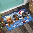 Make a whimsical statement with our Dachshund 'Welcome to Our Ho Ho Home' Doormat. This charming and festive doormat is the perfect way to greet your guests with a touch of holiday cheer. Featuring an adorable Dachshund design and a playful "Ho Ho Home" message, it adds a warm and inviting touch to your entryway. Crafted with durability in mind, this doormat not only welcomes guests but also keeps dirt and debris outside. Elevate your home's holiday decor with this delightful and functional piece.