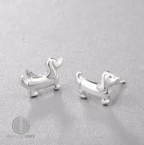 Elevate your style with these "Adorable Cartoon Tiny Dachshund Earrings," designed especially for dog lovers. These charming earrings feature a whimsical and lovable Dachshund design that adds a touch of playfulness to your look. Crafted with attention to detail and a dash of cuteness, they're perfect for showcasing your passion for these endearing dogs. These earrings make a delightful addition to your jewelry collection or a thoughtful gift for fellow dog enthusiasts. Let your love for Dachshunds shine through with these precious accessories that effortlessly capture the essence of this beloved breed.