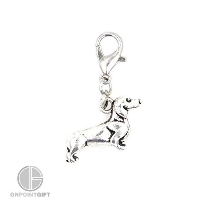 Elevate your style with our Antique Silver Dachshund Dog Zip Charm. This small, clip-on charm is the perfect gift for dog lovers. Add a canine elegance to your accessories and show your love for Dachshunds. Ideal for keys, zippers, or as a decorative piece. Get yours today!  Material: High-quality alloy