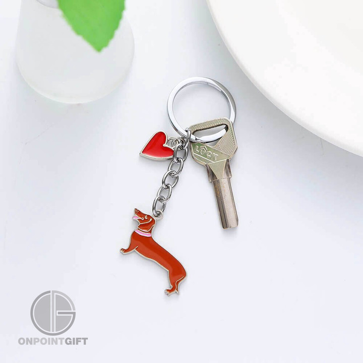 Elevate your style with our Dachshund Dog Enamel Keychain. This cute and charming cartoon animal jewelry is the perfect accessory for women and girls. Attach it to your handbag or car keys to add a touch of personality and charm. It also makes for a delightful and thoughtful gift. Experience the whimsy of a Dachshund companion wherever you go with this adorable keychain.