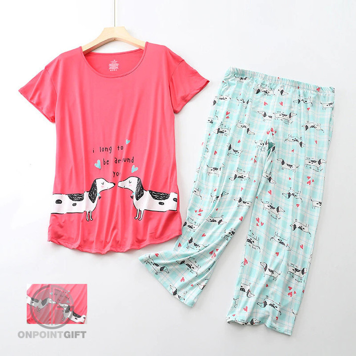 Elevate your summer nights with our delightful Dachshund Teckel Women's Pajamas Set. This two-piece ensemble features short sleeve tops and comfortable capris with an elastic waist. Enjoy the perfect balance of style and comfort during warm nights. The charming Dachshund Teckel print adds a touch of fun to your sleepwear collection. Whether for lounging or a restful night's sleep, these pajamas are a must-have addition to your summer wardrobe. Stay cool and stylish in this seasonal sleepwear set.