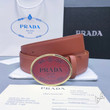 Prada Engraved Logo Buckle Leather Belt In Brown
