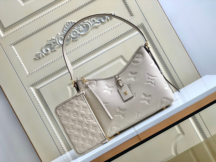 Louis Vuitton CarryAll PM Handbag Monogram Embossed Leather In Ivory