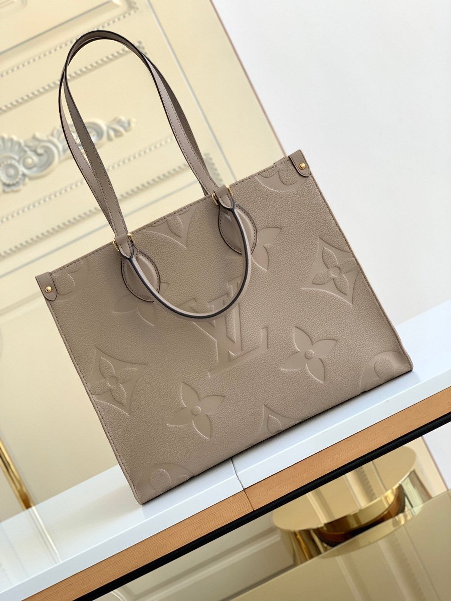 Louis Vuitton Onthego MM Tote Bag Embossed Monogram Empreinte In Beige -  Praise To Heaven