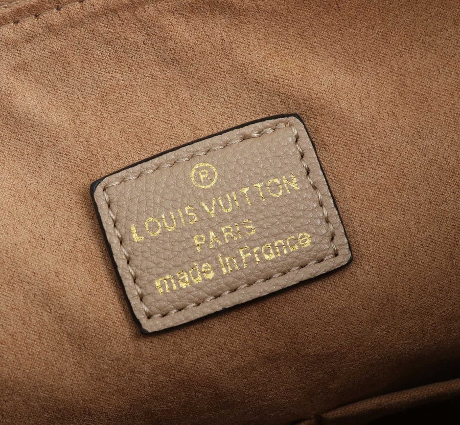 LOUIS VUITTON Women's Maida Hobo Empreinte Leather in Beige