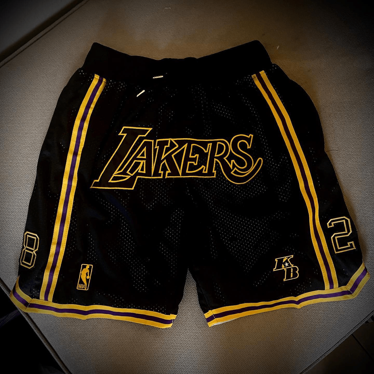 black and yellow laker shorts
