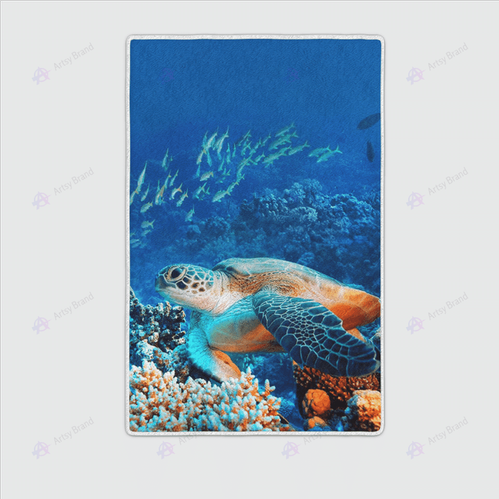 Sea turtle with tropical fish area rug