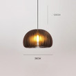 This picture shows a Zepboo black solid wood pumpkin pendant light in size 30cm.