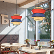 This picture shows two modern rattan red blue decor hanging lamp in the restaurant.