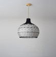 This picture shows a rattan woven vintage black and white art hanging light.