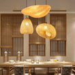 This picture shows three creative farmhouse hat bamboo pendant lamps in the tea house.
