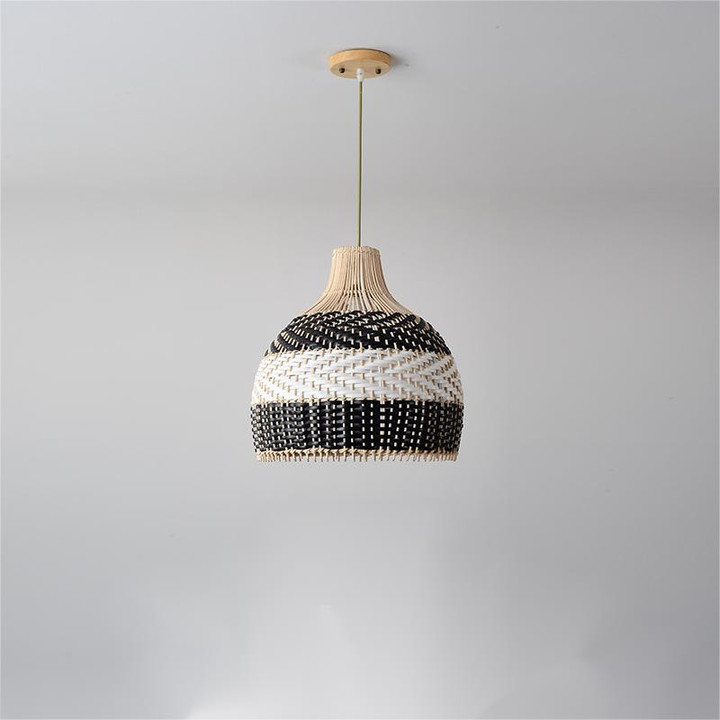 This picture shows a rattan black and white woven vintage pendant lamp in size 40cm.