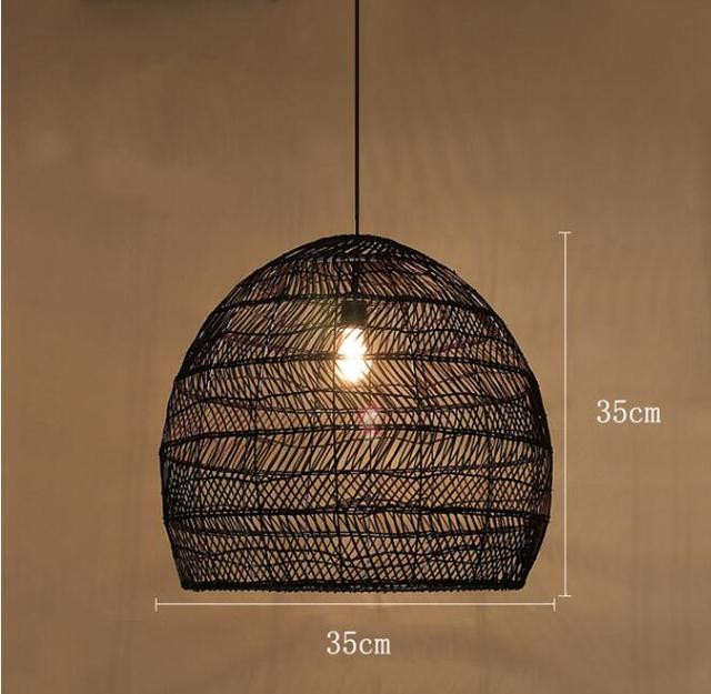This picture shows a black vintage rattan woven pendant lamp in size 35cm.