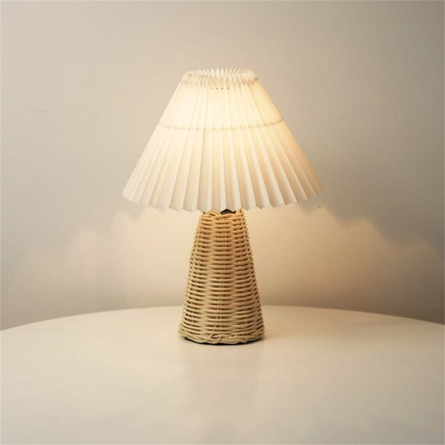 This picture shows a rattan desktop decorative USB bedside lamp in white color.