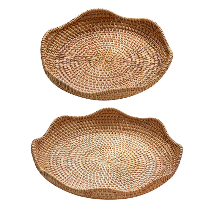 This picture shows two rattan round serving tray food storage wicker tray.