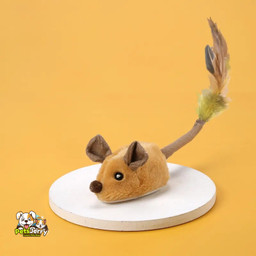 Playful cat chasing realistic mouse toy