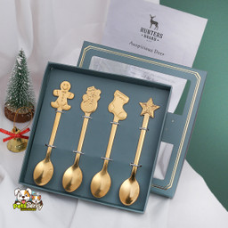 Red Christmas spatula, green Christmas spoon, blue Christmas whisk, and white Christmas fork with festive holiday designs