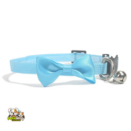 Adorable dog wearing an adjustable pet collar with a bow bell.