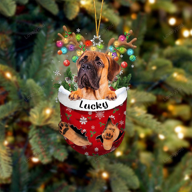 Dog in snow pocket ornament 