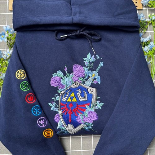The Legend Of Zelda Embroidered Sweatshirt, Floral Master Sword & Shield Embroidered Hoodie, Fantasy Video Game Embroidered Mockneck Sweatshirt, Zelda Inspired Gamer Embroidered Gingham Sweatshirt