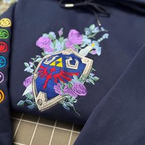 The Legend Of Zelda Embroidered Sweatshirt, Floral Master Sword & Shield Embroidered Hoodie, Fantasy Video Game Embroidered Mockneck Sweatshirt, Zelda Inspired Gamer Embroidered Gingham Sweatshirt
