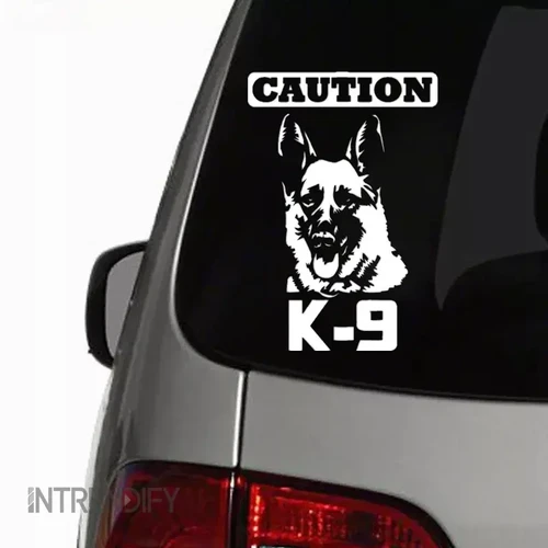 Funny car decal warning of a K9 German Shepherd, suitable for car bumpers and windows