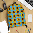 Various accessories of sunflower design on colorful background.