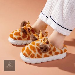 Stay cozy this winter with cute giraffe cartoon home slippers for men and women. Featuring thick soles, a warm design, and non-slip bottoms, these comfy indoor shoes are perfect for relaxing at home or gifting to someone special.