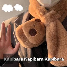 Stay cozy and stylish with this adorable Capybara Plush Wearable Scarf Blanket! Soft, thick, windproof, and warm, it's perfect for chilly autumn and winter days. A cute and thoughtful gift for capybara lovers!