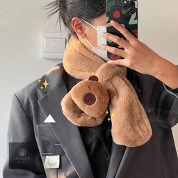 Stay cozy and stylish with this adorable Capybara Plush Wearable Scarf Blanket! Soft, thick, windproof, and warm, it's perfect for chilly autumn and winter days. A cute and thoughtful gift for capybara lovers!