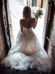 Customized Strapless Wedding Dress with Crystals, Lace Appliques, and Flowing Design