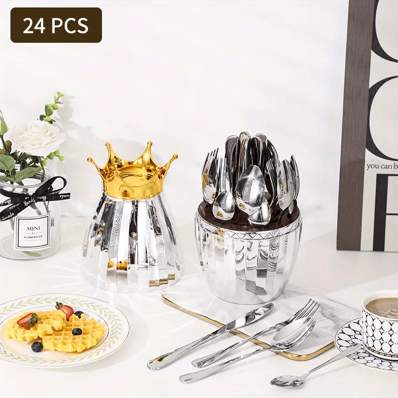 Mirror-polished gold forks and spoons arranged for a formal dinner party