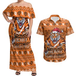 Personalized Wests Tigers Christmas Couples Matching Off Shoulder Maxi Dress and Hawaiian Shirt Australian Rugby Fans - Pixelated Ugly Xmas Pattern Mascot Santa