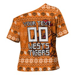 Personalized Wests Tigers Christmas Cross Shoulder Shirt Australian Rugby Fans - Pixelated Ugly Xmas Pattern Mascot Santa