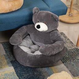 Gery plush dog sofa bed on a blue couch