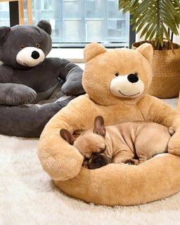 Dog curled up asleep in khaki plush dog sofa bed