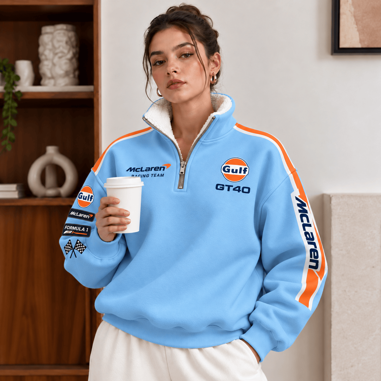 Close-up of the soft white sherpa collar on a sky-blue quarter-zip pullover