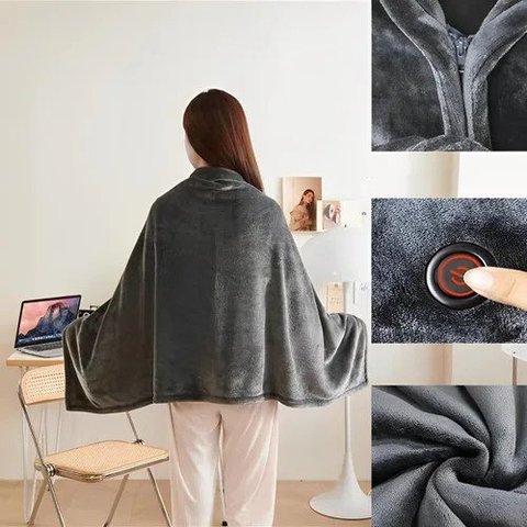 The Wearable USB Heated Blanket worn over the shoulders at a desk