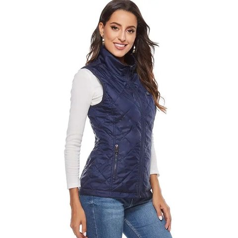The Women's USB Heated Vest in blue, worn over a white top