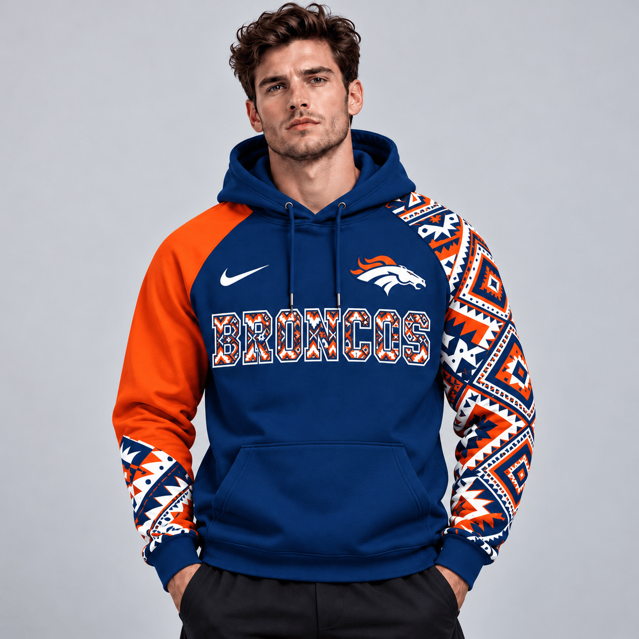 Denver Broncos | Premium NFL Aztec Inspired Colorblock Pullover Hoodie With Asymmetric Sleeves And Bold Team Lettering NDN cover