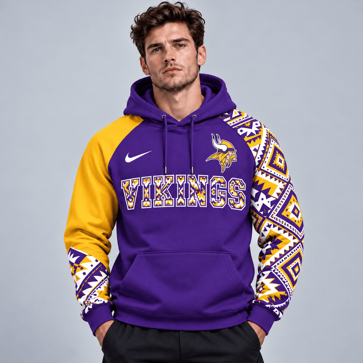 Minnesota Vikings | Premium NFL Aztec Inspired Colorblock Pullover Hoodie With Asymmetric Sleeves And Bold Team Lettering NDN cover