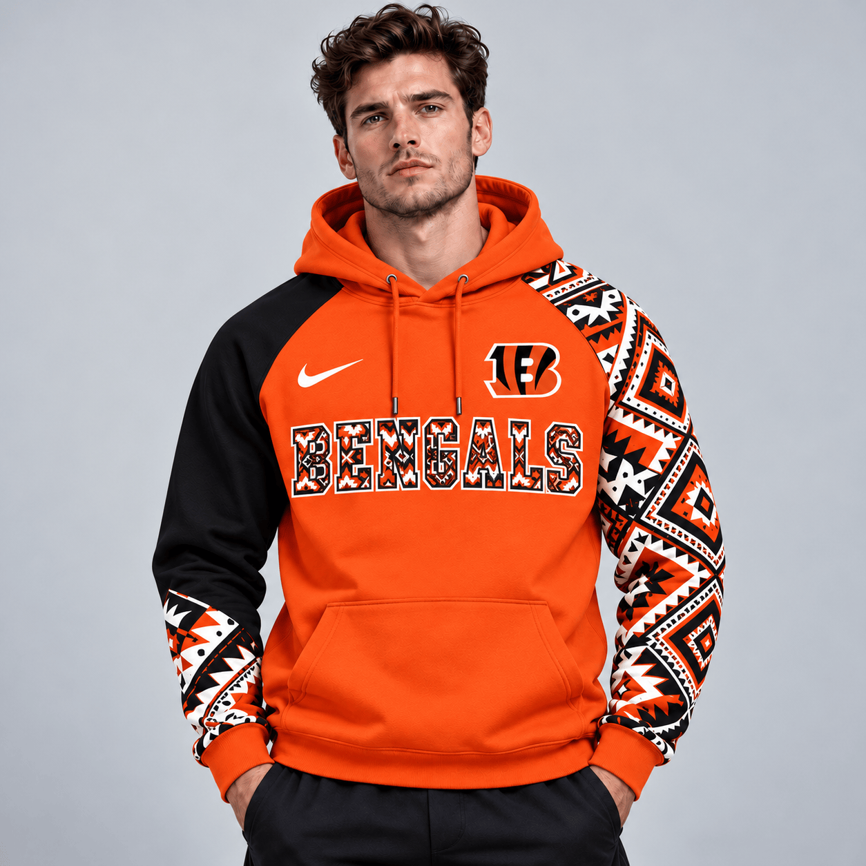 Cincinnati Bengals | Premium NFL Aztec Inspired Colorblock Pullover Hoodie With Asymmetric Sleeves And Bold Team Lettering NDN cover