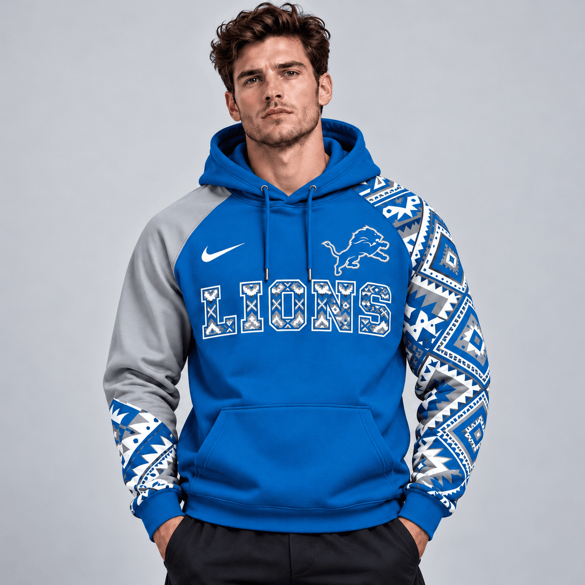 Detroit Lions | Premium NFL Aztec Inspired Colorblock Pullover Hoodie With Asymmetric Sleeves And Bold Team Lettering NDN cover