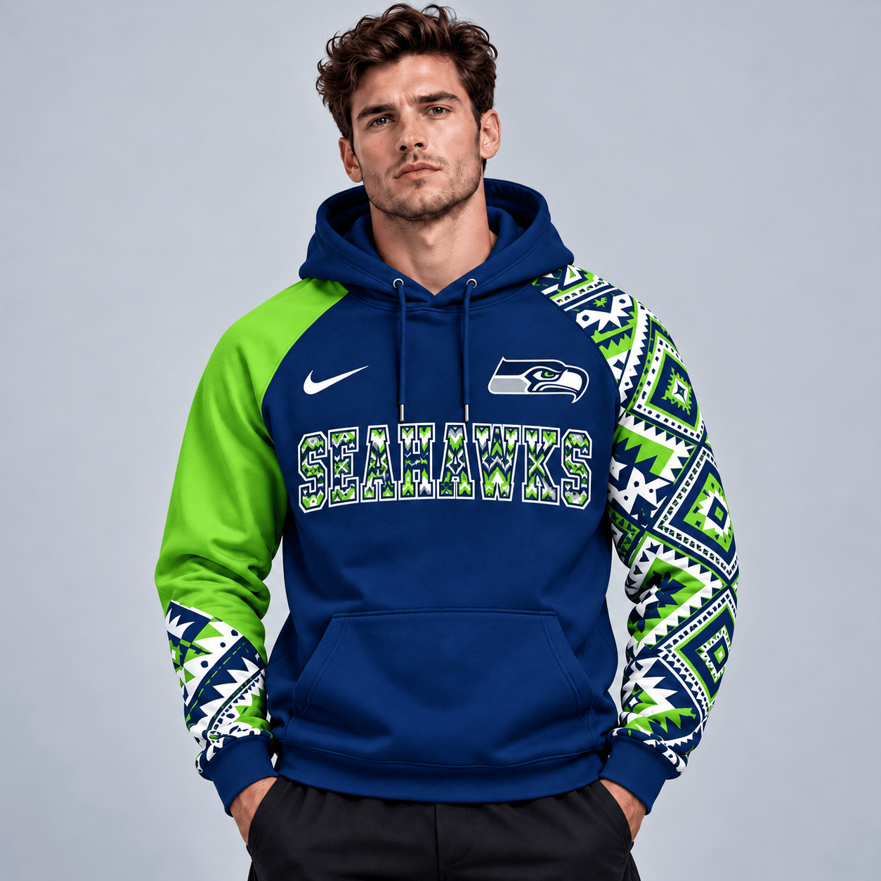 Seattle Seahawks | Premium NFL Aztec Inspired Colorblock Pullover Hoodie With Asymmetric Sleeves And Bold Team Lettering NDN cover