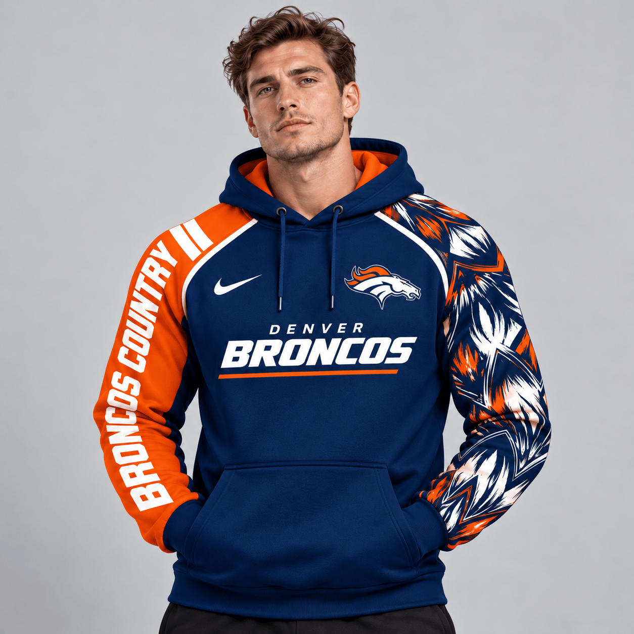 Denver Broncos | Premium NFL Dynamic Brushstroke Graphic Asymmetric Sleeve Pullover Hoodie With Team Logo And Bold Lettering NDN cover