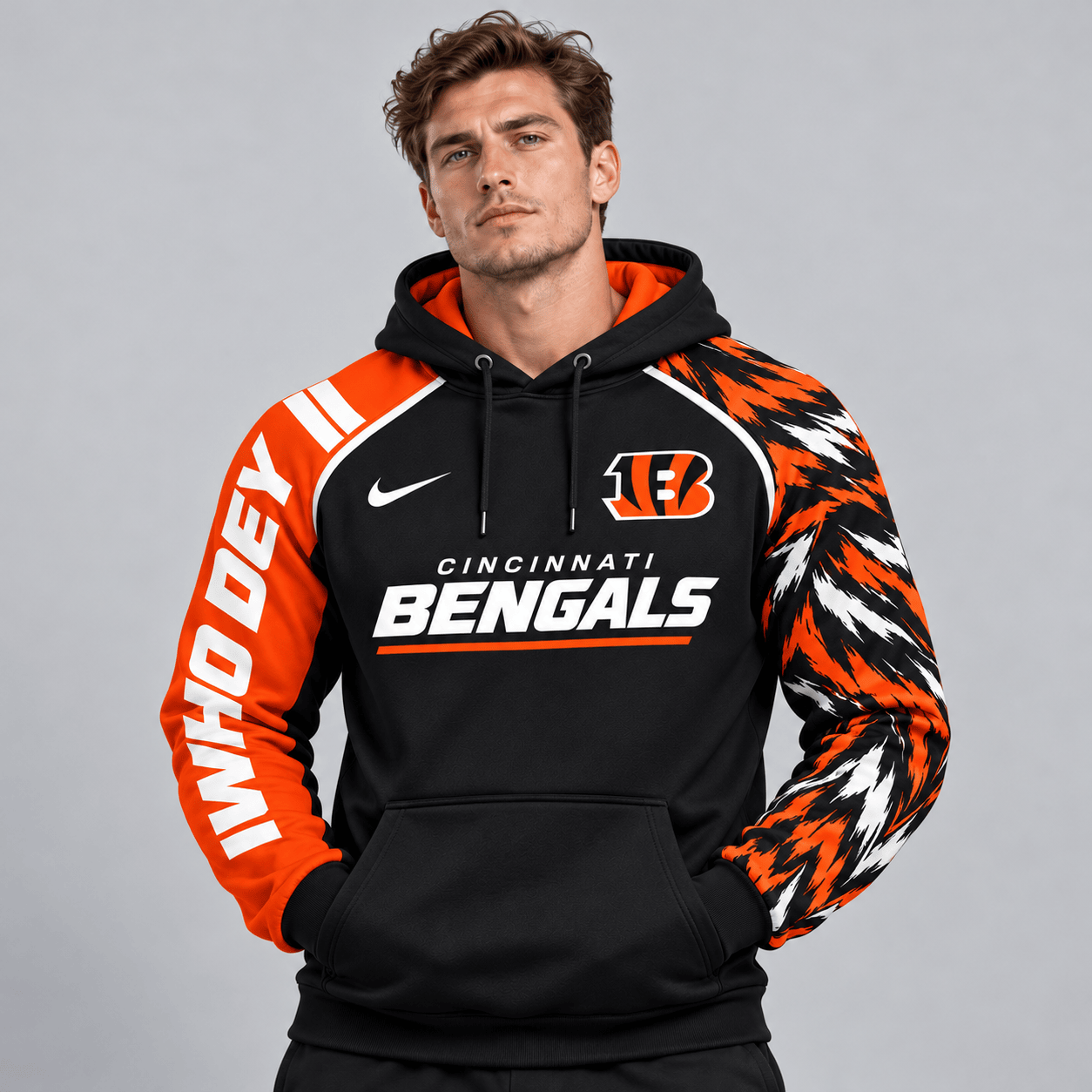 Cincinnati Bengals | Premium NFL Dynamic Brushstroke Graphic Asymmetric Sleeve Pullover Hoodie With Team Logo And Bold Lettering NDN cover