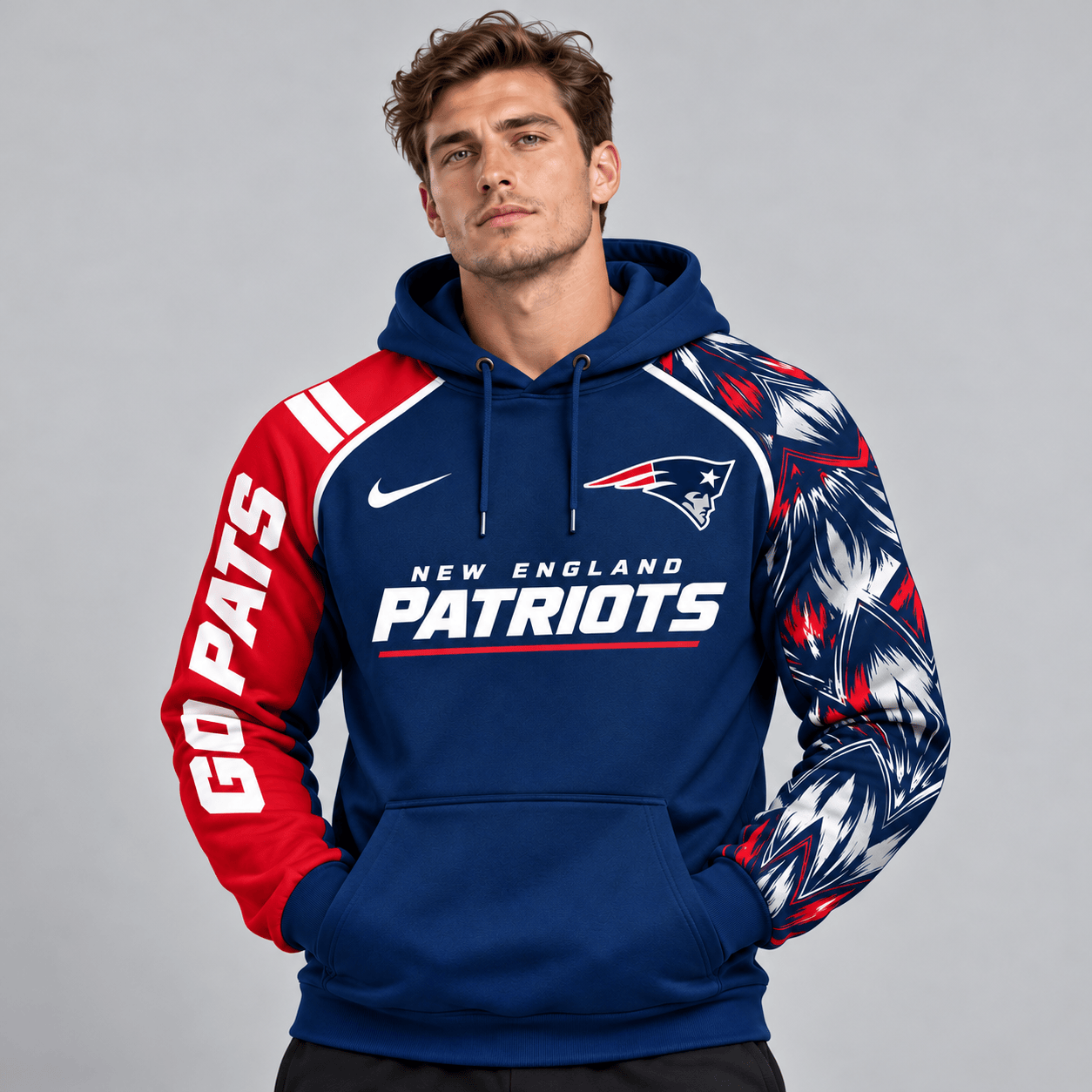 New England Patriots | Premium NFL Dynamic Brushstroke Graphic Asymmetric Sleeve Pullover Hoodie With Team Logo And Bold Lettering NDN cover