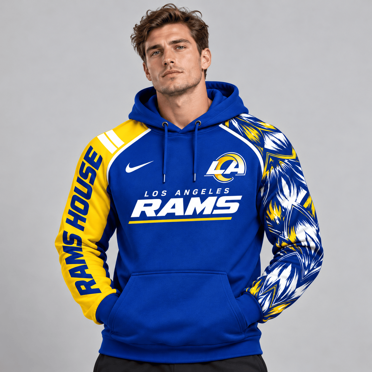 Los Angeles Rams | Premium NFL Dynamic Brushstroke Graphic Asymmetric Sleeve Pullover Hoodie With Team Logo And Bold Lettering NDN cover