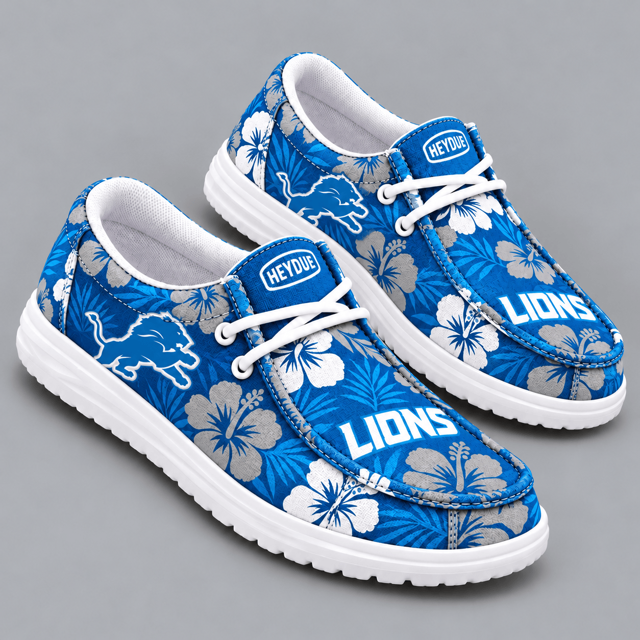 Detroit Lions | Premium NFL Tropical Hibiscus Floral Print HEYDUDE Casual Loafers With Team Logo And Lightweight Comfort Sole NDN cover